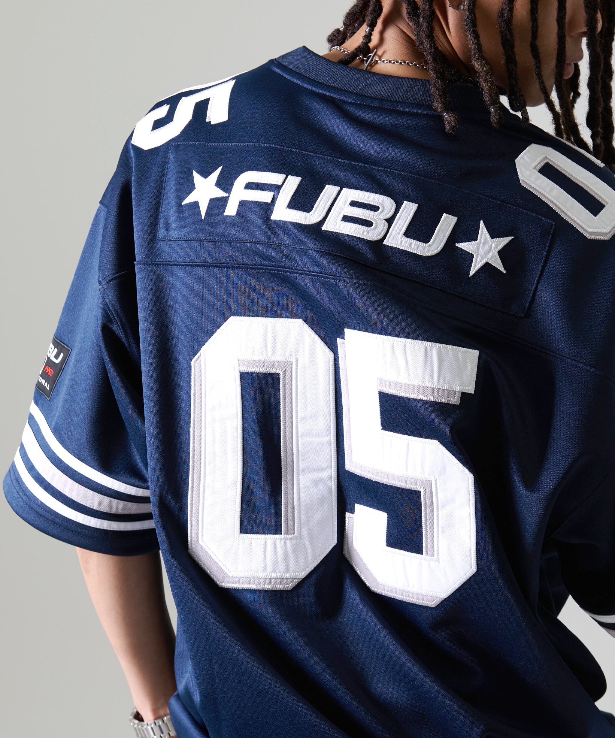 FUBU フブ トップス ブランド ロゴ フットボール ゲームシャツ。FUBUは